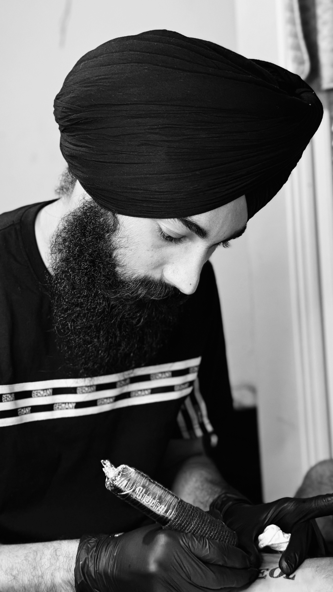 Manpreet — tattoo artist at Manpreet Inks crafting a piece
